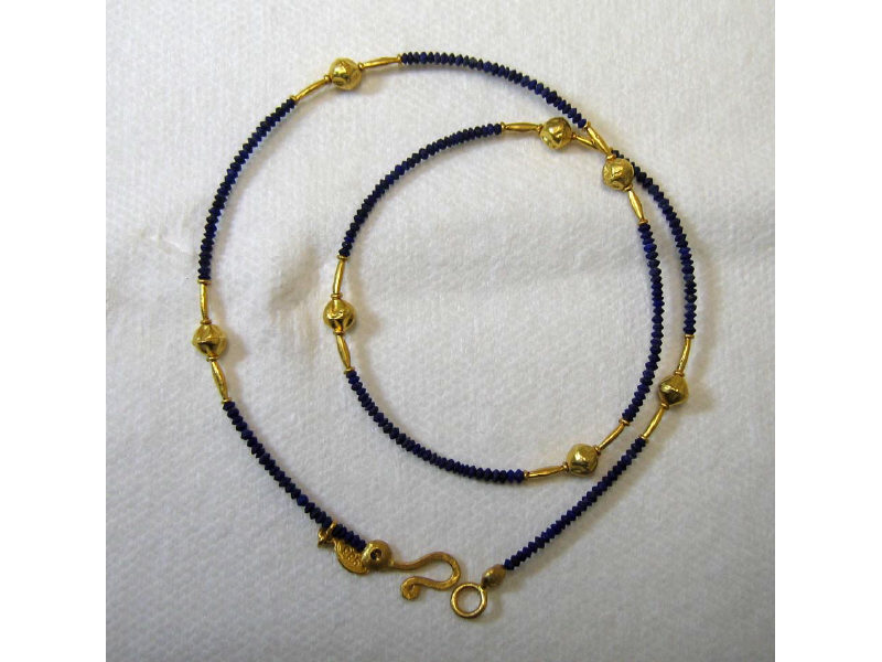 Appraisal: LAPIS AND GOLD BEADS Lapis beads strung with k yellow