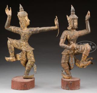 Appraisal: PAIR OF CARVED WOOD STATUES th century Thailand The first