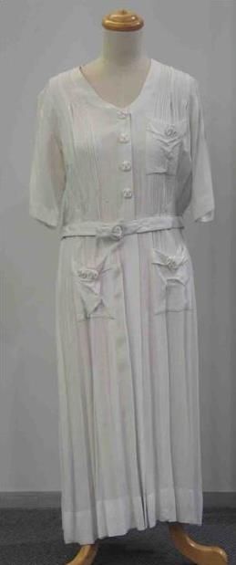 Appraisal: Tennis dress in white rayon with buttoned front and original