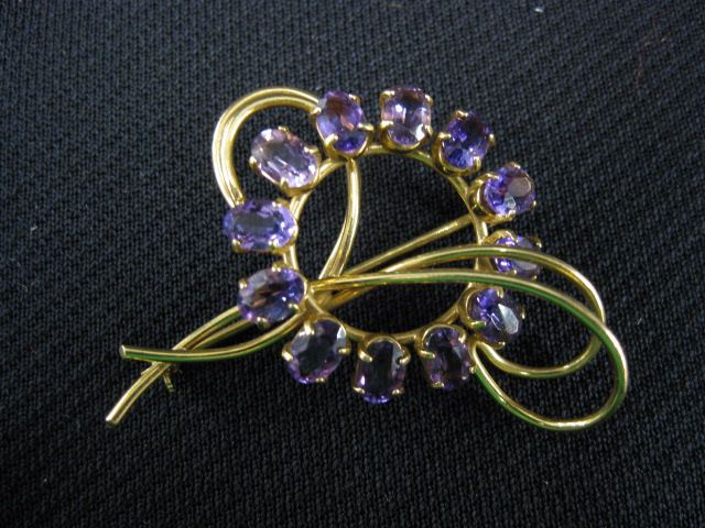 Appraisal: Amethyst Brooch k yellow gold oval gems totaling over carats