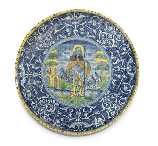 Appraisal: A documentary Lyon or Nevers berrettino-ground faience footed circular dish