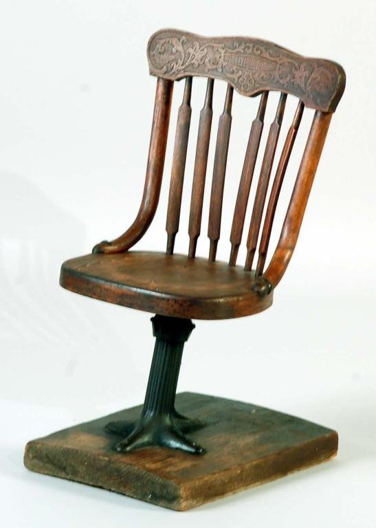 Appraisal: A mixed wood child's barber chair consisting of a carved