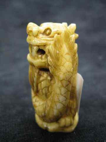 Appraisal: Carved Ivory Netsuke of a Dragon '' signed