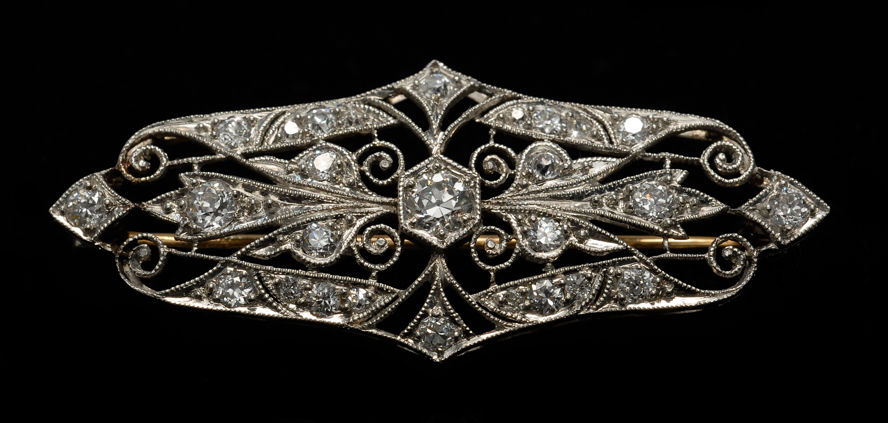 Appraisal: KT WHITE GOLD AND DIAMOND BROOCH Twenty-seven diamonds of various