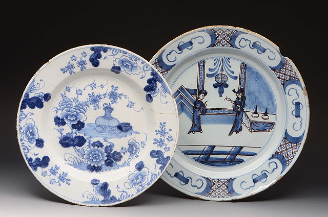 Appraisal: A LAMBETH DELFT BLUE WHITE AND MANGANESE CIRCULAR PLATE decorated