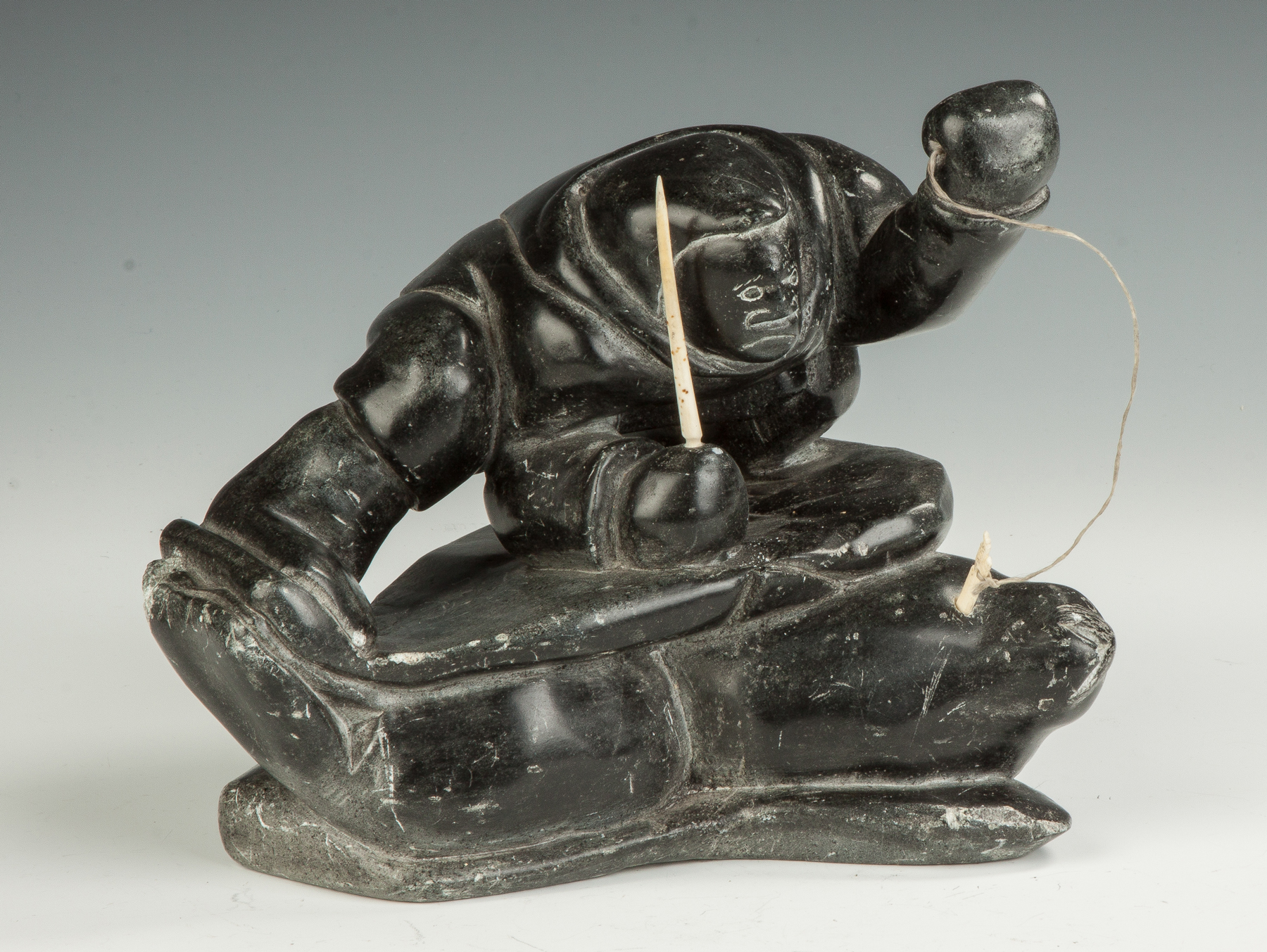 Appraisal: Inuit Carved Soapstone of a Seal Hunter