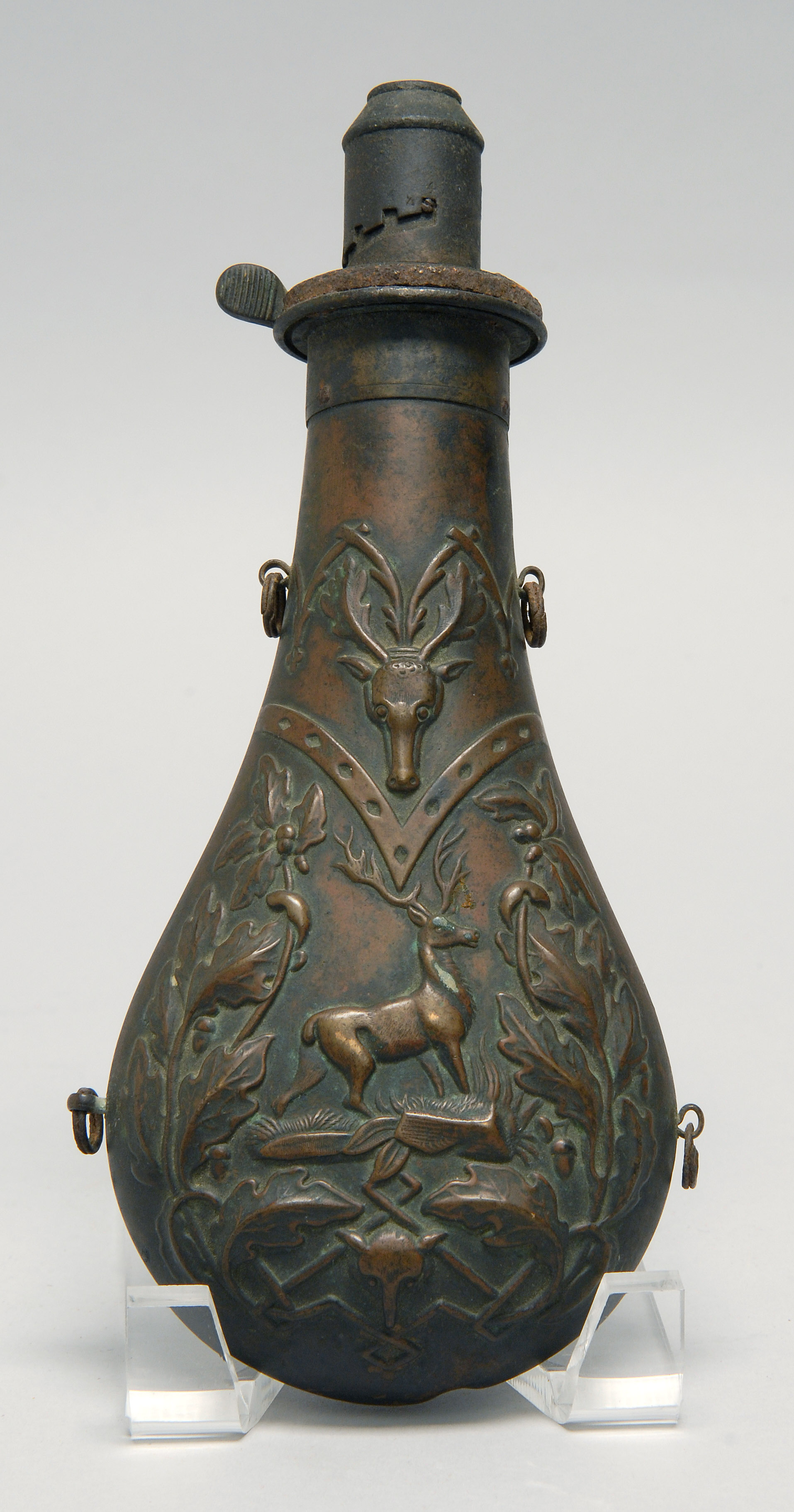 Appraisal: TH CENTURY ENGLISH COPPER POWDER FLASK with stag decoration Height