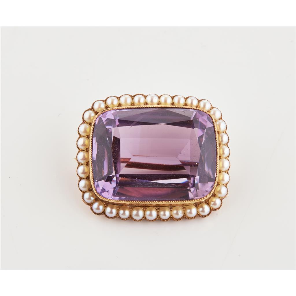 Appraisal: An amethyst and seed pearl set brooch collet set with