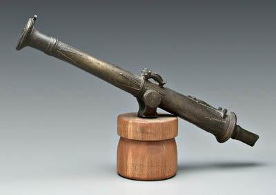 Appraisal: Swiveling brass cannon alligator and geometric decoration mounted on later