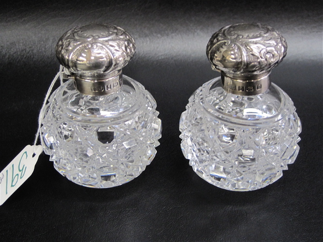 Appraisal: PAIR OF ENGLISH STERLING CUT GLASS PERFUMES hinged lids hallmarked