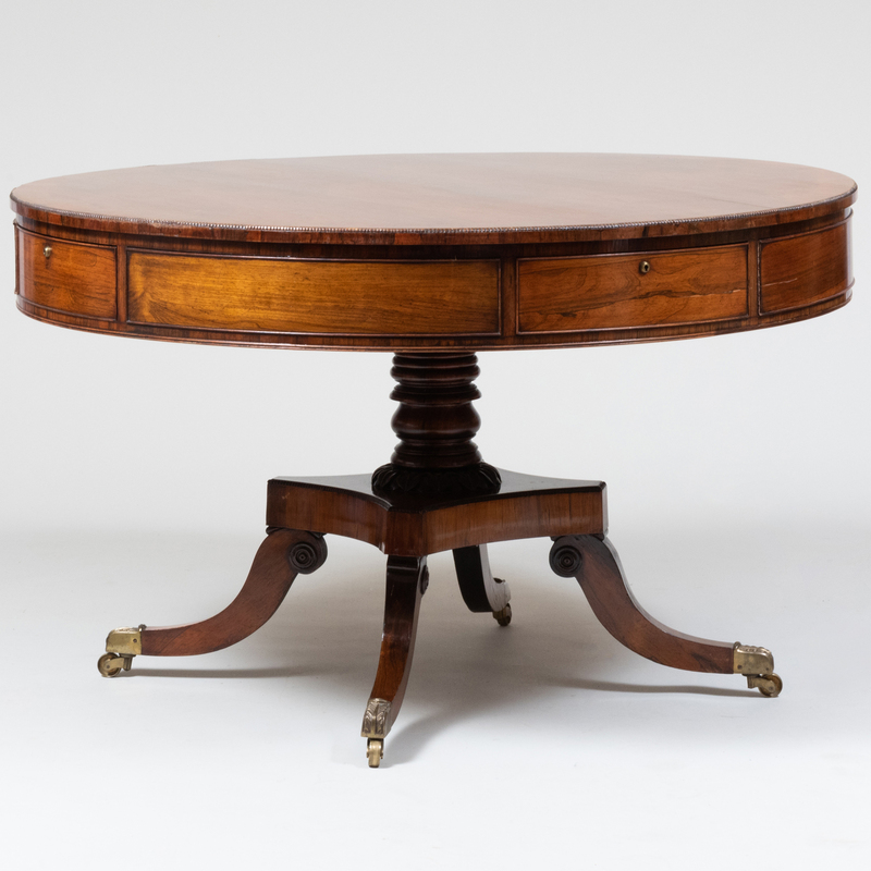 Appraisal: Regency Rosewood Drum Table On casters One drawer stamped 'JJ'