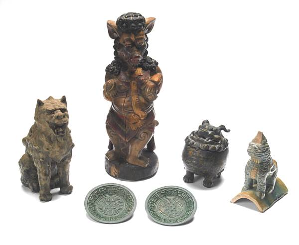 Appraisal: A group of Asian ornaments comprising wood carvings cast metal