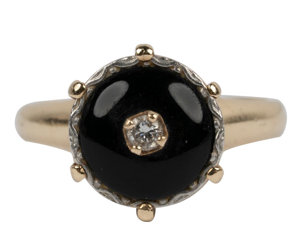 Appraisal: KARAT YELLOW GOLD ONYX DIAMOND RINGcentering one full cut diamond