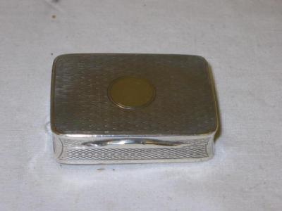 Appraisal: A SNUFF BOX of oblong form with circular blind cartouche