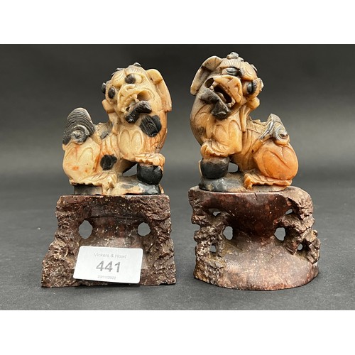 Appraisal: Pair of soap stone dogs of Fo on stands each