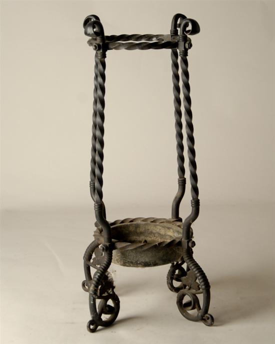 Appraisal: Wrought Iron Umbrella Stand twisted elements floriate feet H Dia