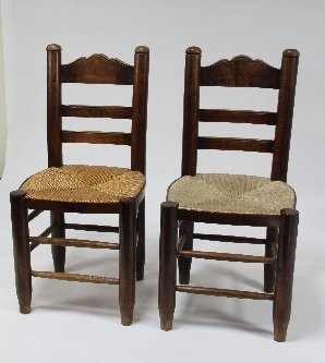 Appraisal: A set of eight French provincial fruitwood ladder back chairs