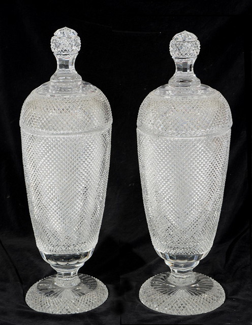 Appraisal: A PAIR OF TALL CUT GLASS SWEETMEAT JARS and covers