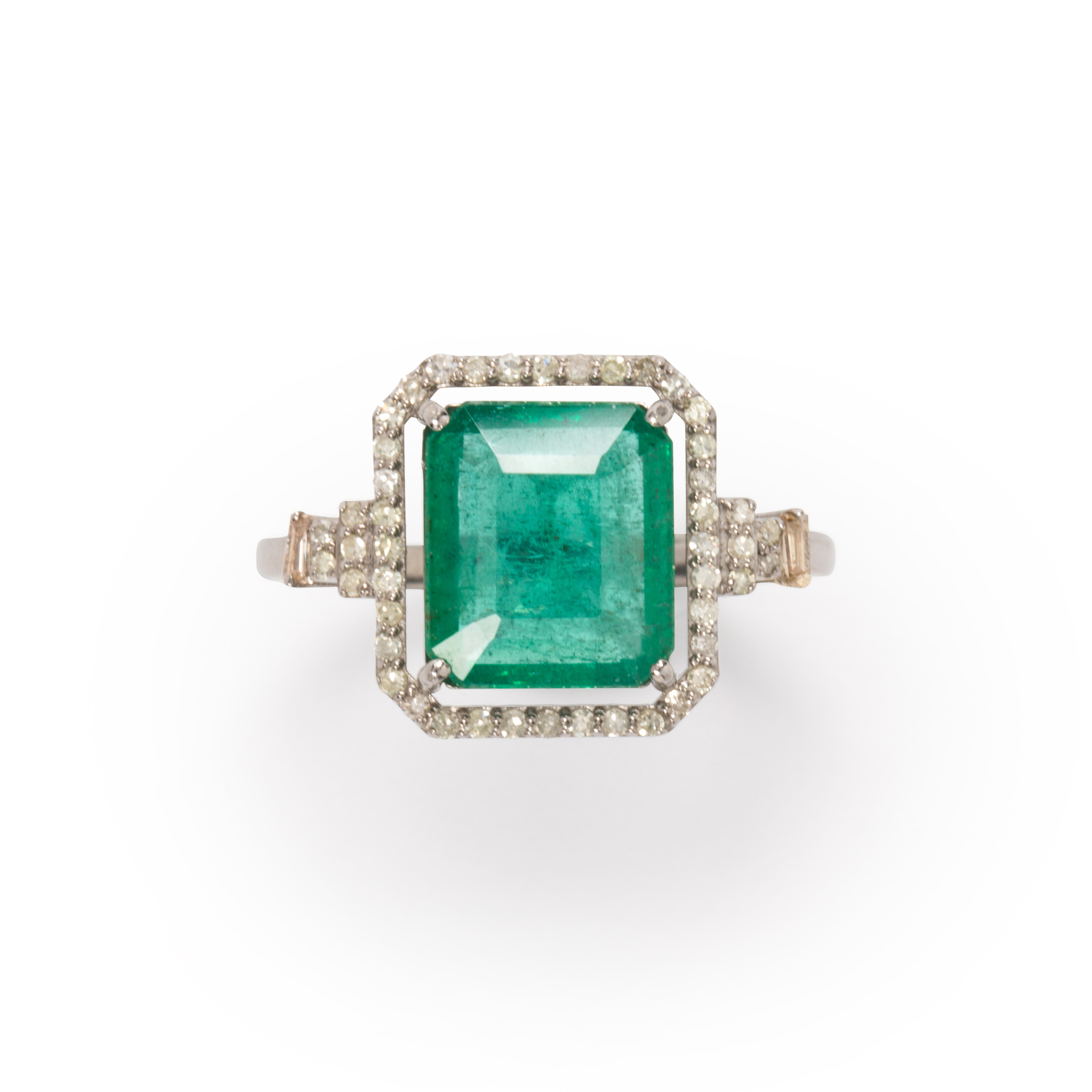 Appraisal: AN EMERALD AND DIAMOND RING An emerald and diamond ring