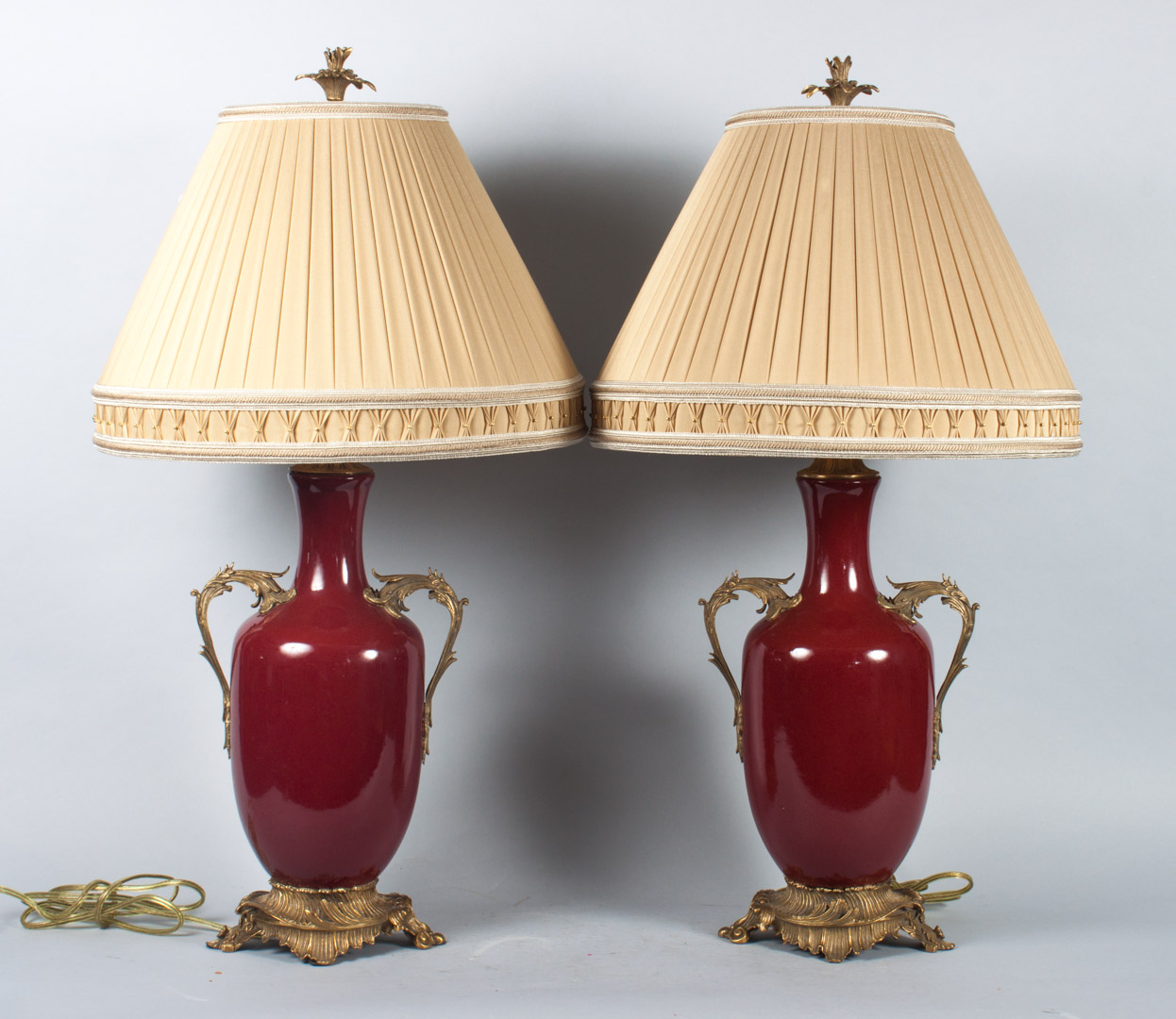 Appraisal: Pair of sang du boeuf style porcelain lamps set in