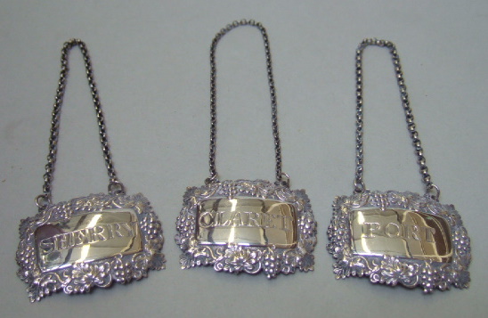 Appraisal: Three similar silver decanter labels comprising PORT CLARET and SHERRY