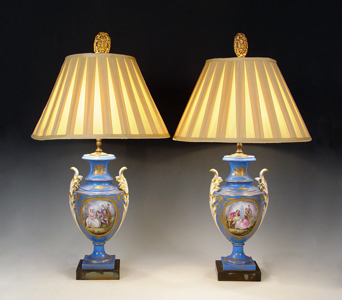 Appraisal: SIGNED SEVRES FRENCH PORCELAIN LAMPS Hand painted courting scenes floral