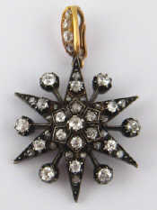 Appraisal: A Victorian old brilliant and rose cut diamond star pendant