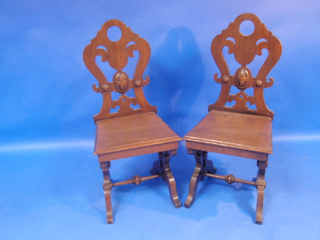 Appraisal: A pair of Victorian shield back hall chairs