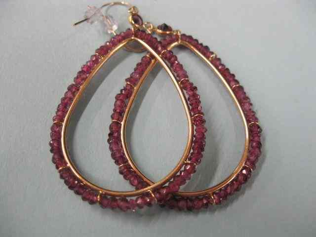 Appraisal: Ruby Earrings large k gold hoops each with faceted gems