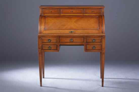 Appraisal: FRENCH NEOCLASSICAL STYLE CHERRYWOOD CYLINDER DESK Frieze-fitted with three-aligned drawers