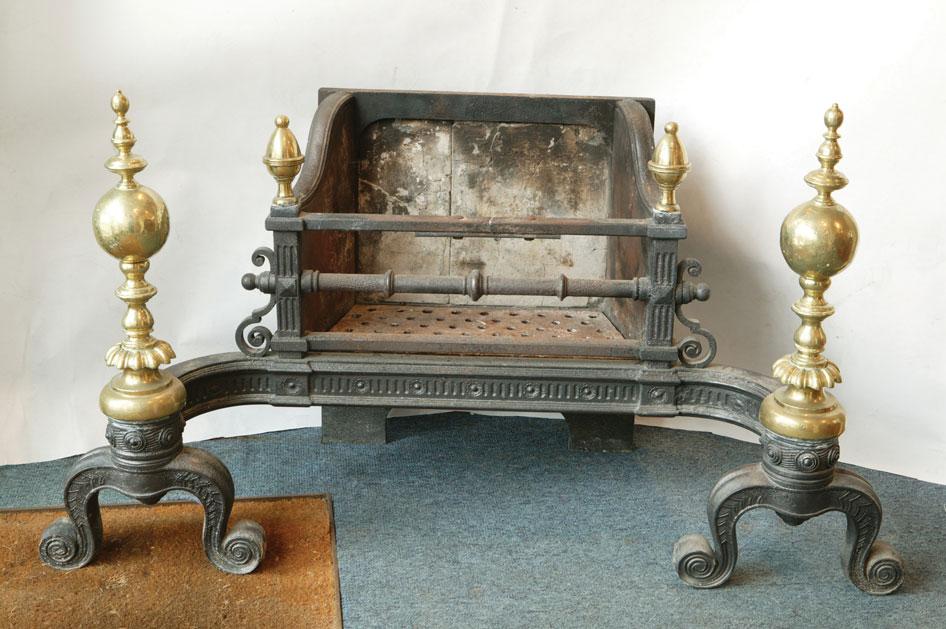 Appraisal: A CAST IRON AND BRASS MOUNTED FIRE BASKET the open