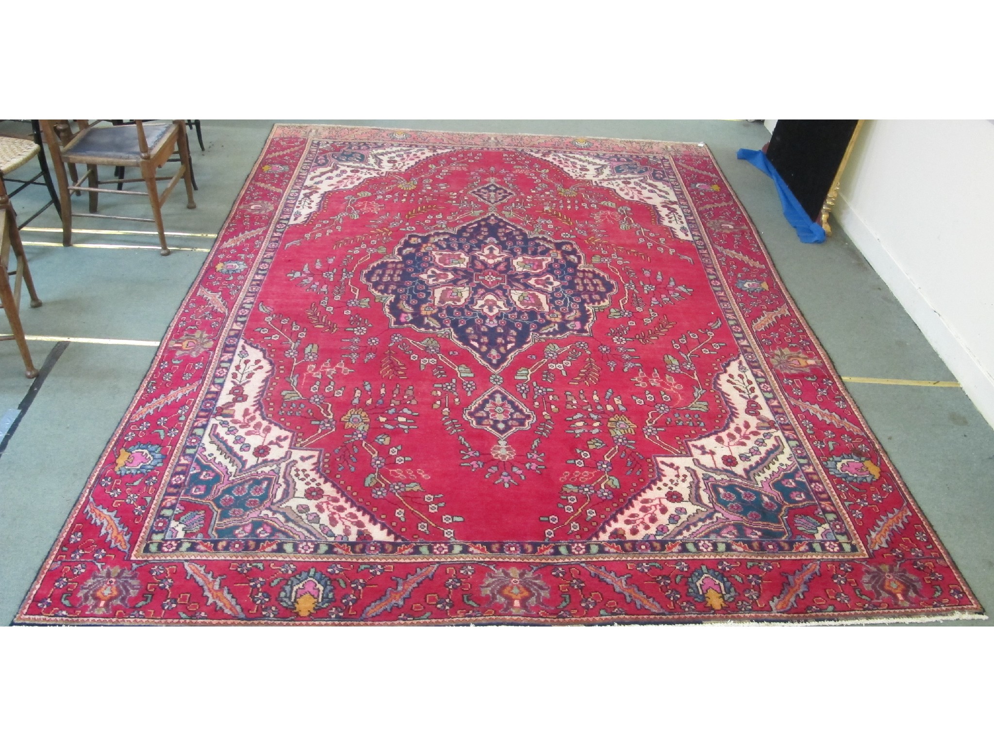 Appraisal: A Tabriz rug on a red and cream ground x