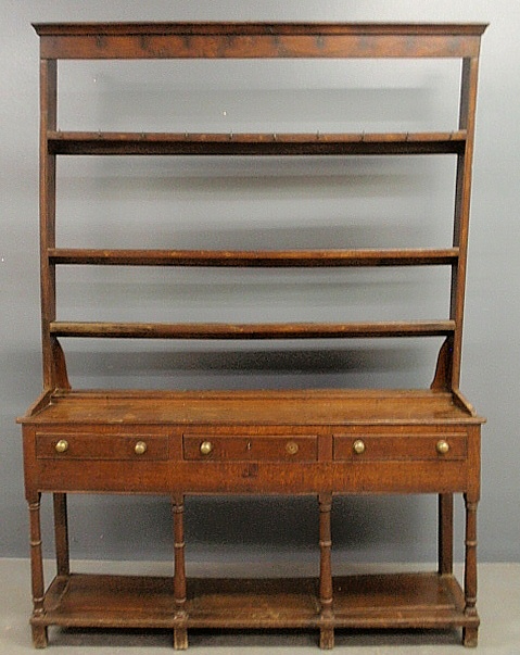 Appraisal: - English oak Welsh dresser with open back plate rack