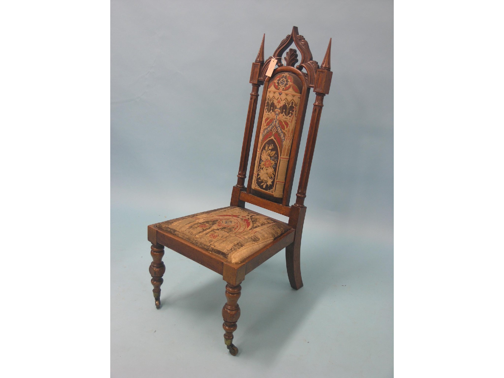 Appraisal: A Victorian rosewood gothic drawing room single chair arched back