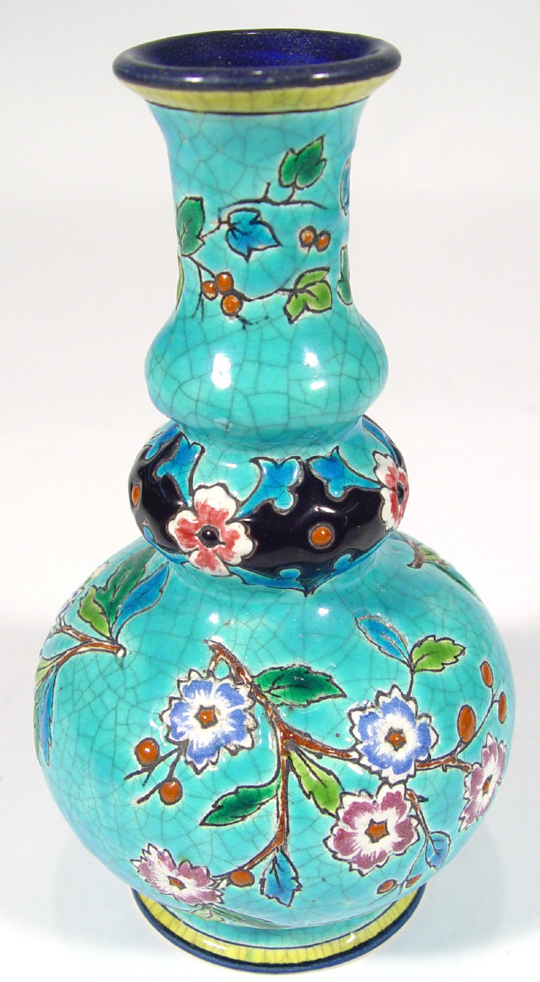 Appraisal: Longwy pottery bottle vase enamelled and relief moulded with flowers