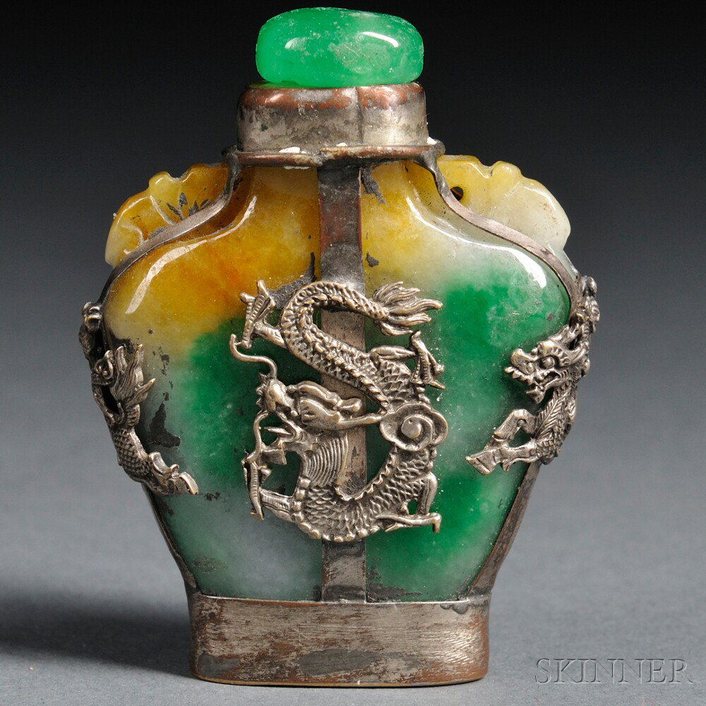 Appraisal: Metal-mounted Jade Snuff Bottle China flattened baluster form shoulders carved