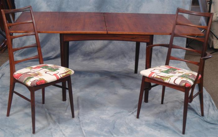 Appraisal: Rosewood Danish DR table with chairs fold over and revolving