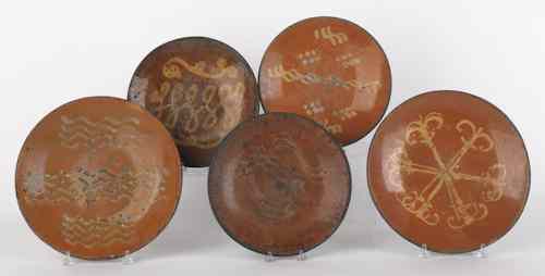 Appraisal: Five American redware chargers th c with slip decoration dia