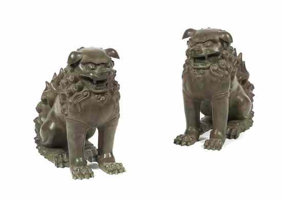 Appraisal: A Pair of Chinese Bronze Foo Dogs in the Kuang