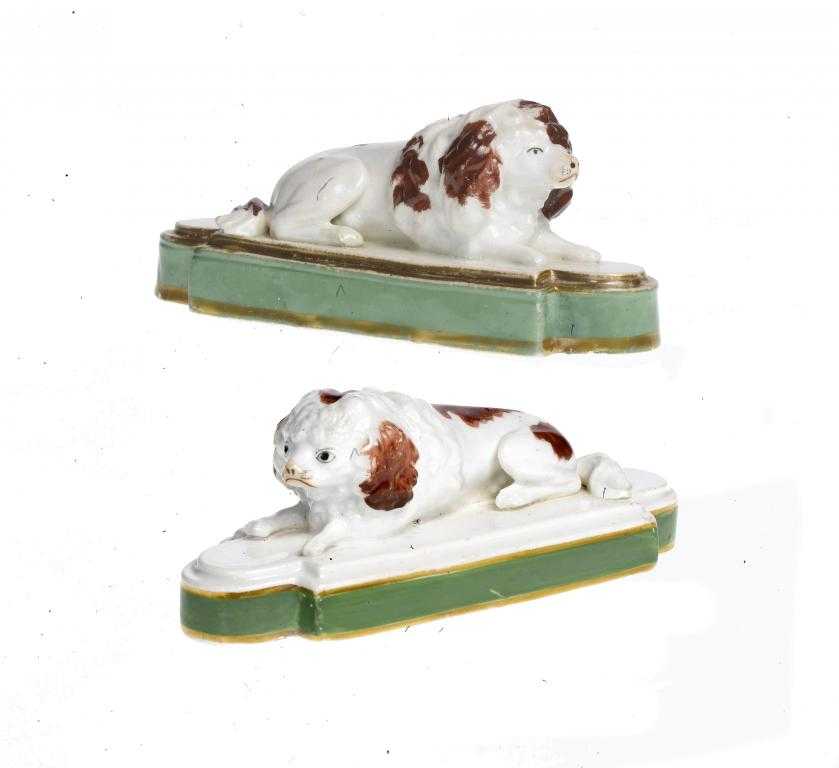 Appraisal: A PAIR OF STAFFORDSHIRE PORCELAIN MODELS OF POODLES sponged with