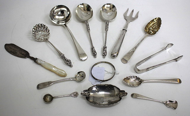 Appraisal: A PAIR OF VICTORIAN SILVER SERVING SPOONS the twist handles