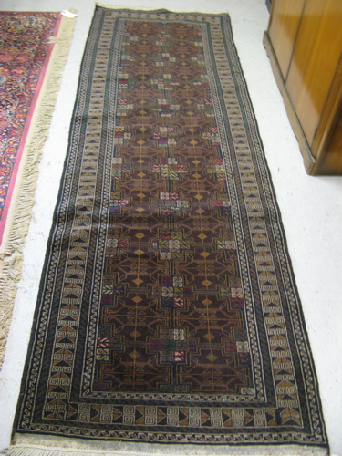 Appraisal: BELOUCHI TRIBAL RUNNER overall geometric design on brown ground hand