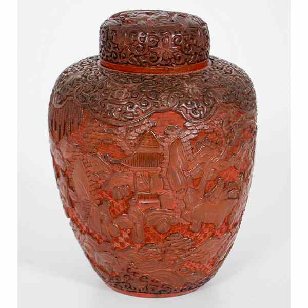 Appraisal: Cinnabar-like Jar Chinese A cinnabar-like lidded jar with carved figural