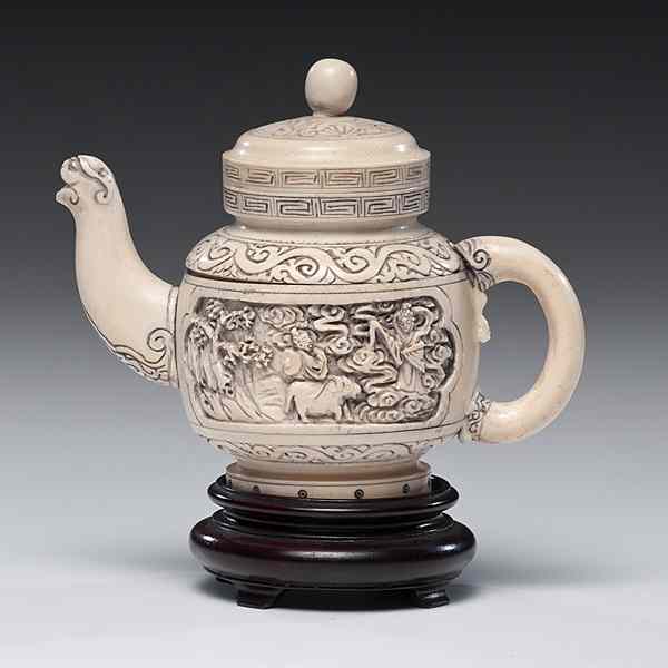 Appraisal: Chinese Carved Ivory Teapot Chinese An ivory teapot with cartouches