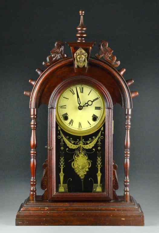 Appraisal: Victorian Gingerbread ClockHaving carved decoration with finial brass Muse decoration