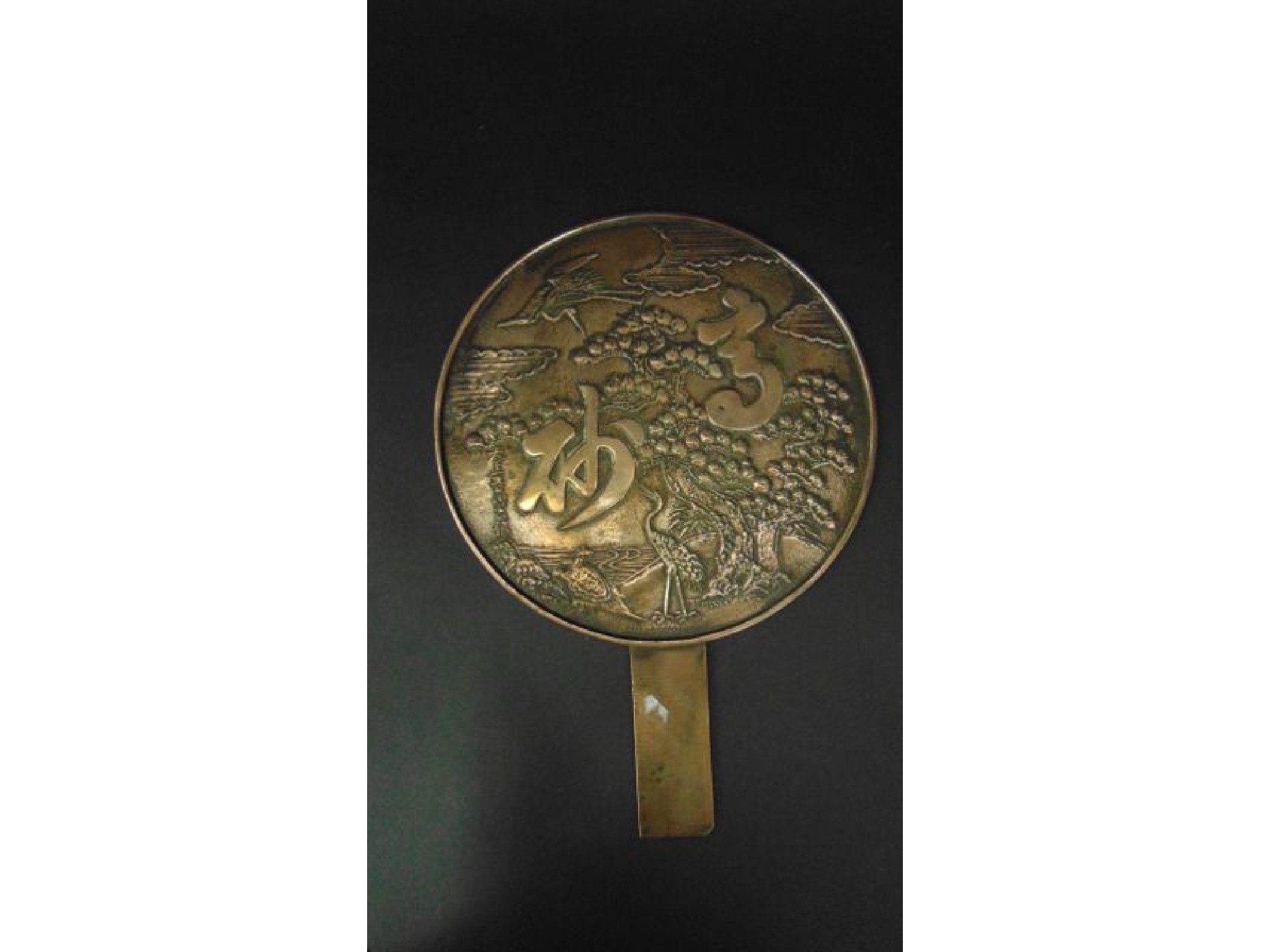 Appraisal: A th century Japanese bronze mirror the reverse detailing prunus