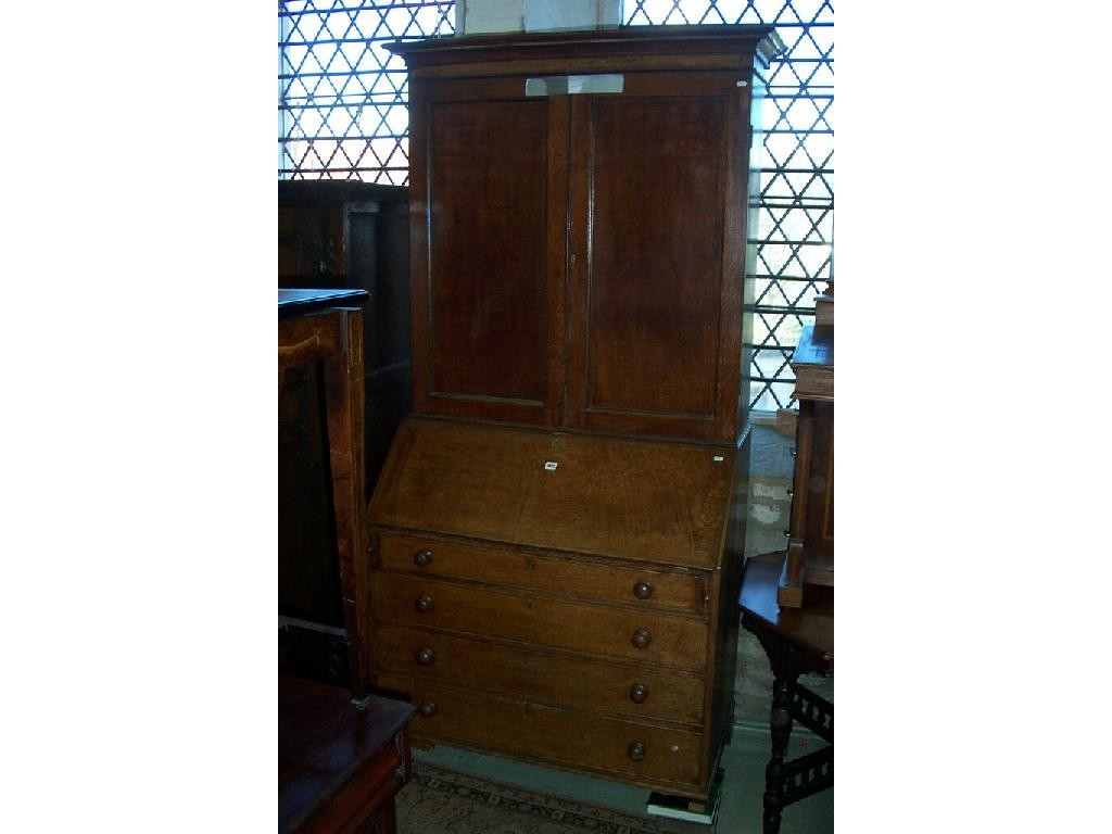 Appraisal: A Georgian bureau fitted with fall front enclosing a fitted