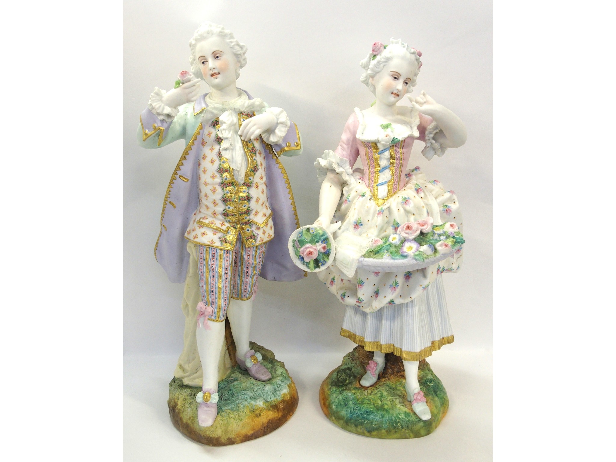 Appraisal: Pair of large continental painted bisque figures of a man