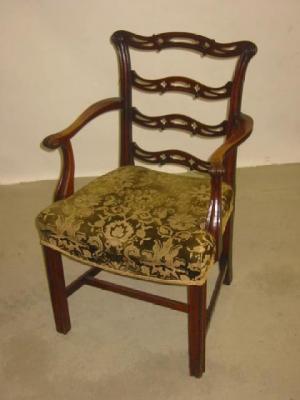 Appraisal: A GEORGE III OAK ELBOW CHAIR of ladder back form