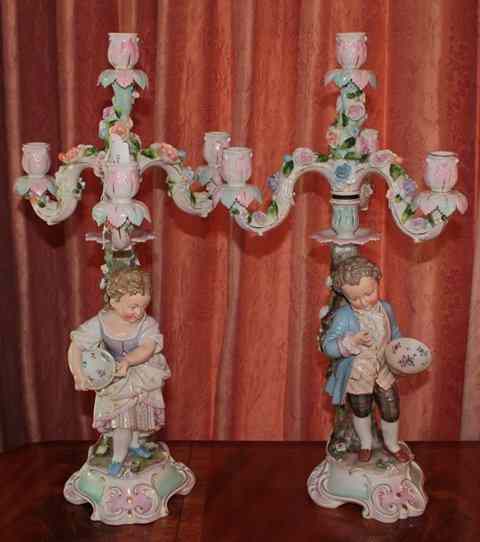 Appraisal: A PAIR OF CONTINENTAL PORCELAIN THREE BRANCH FOUR LIGHT CANDELABRA